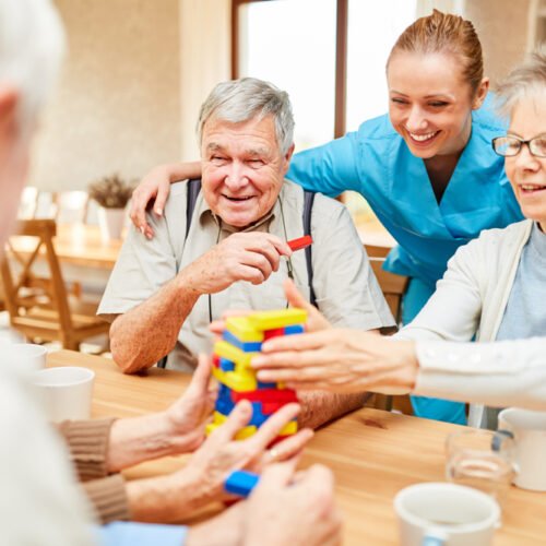 Nursing,Home,Care,In,Demente,Seniors,While,Playing,With,Building